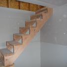 Finished drywall under the stairs.
