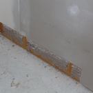 Drywall removed to attach shower pan to studs