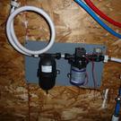 Pump with filter and accumulator