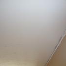 Moulding will cover the ceiling/wall joints.