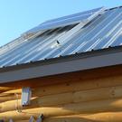 Panels mounted high on roof to negate shading from trees.
